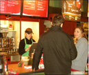 People ordering at library cafe