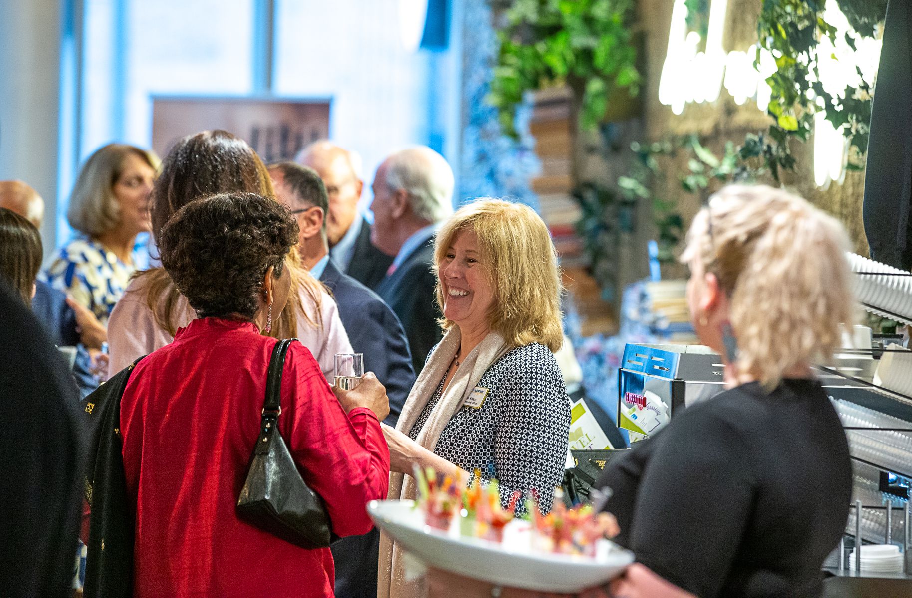 Alice talking with guests