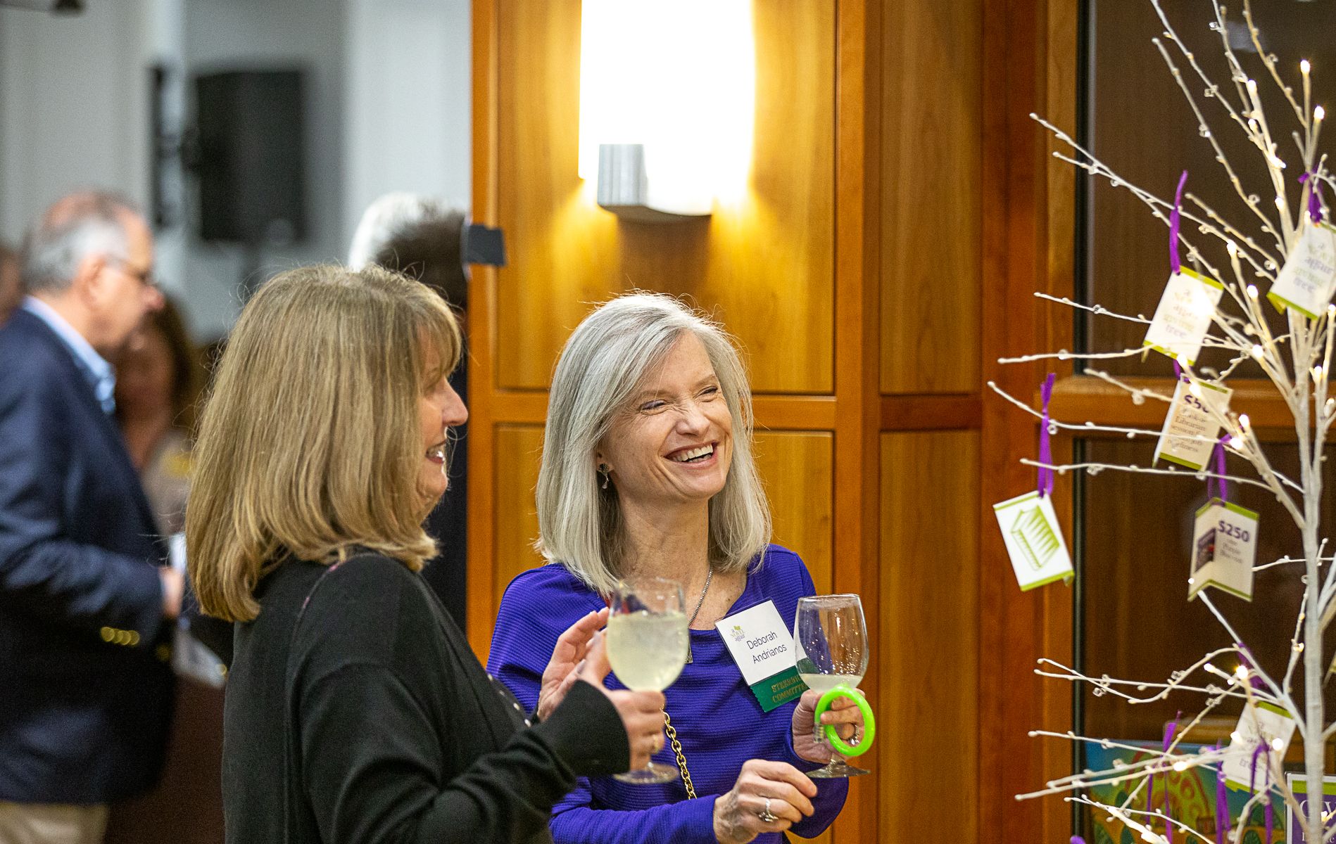 Deb Andrianos and Leslie Bruzik at giving tree