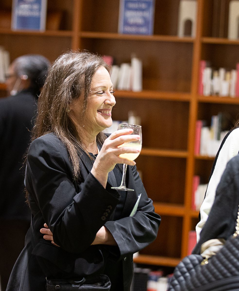 guest laughing with wine