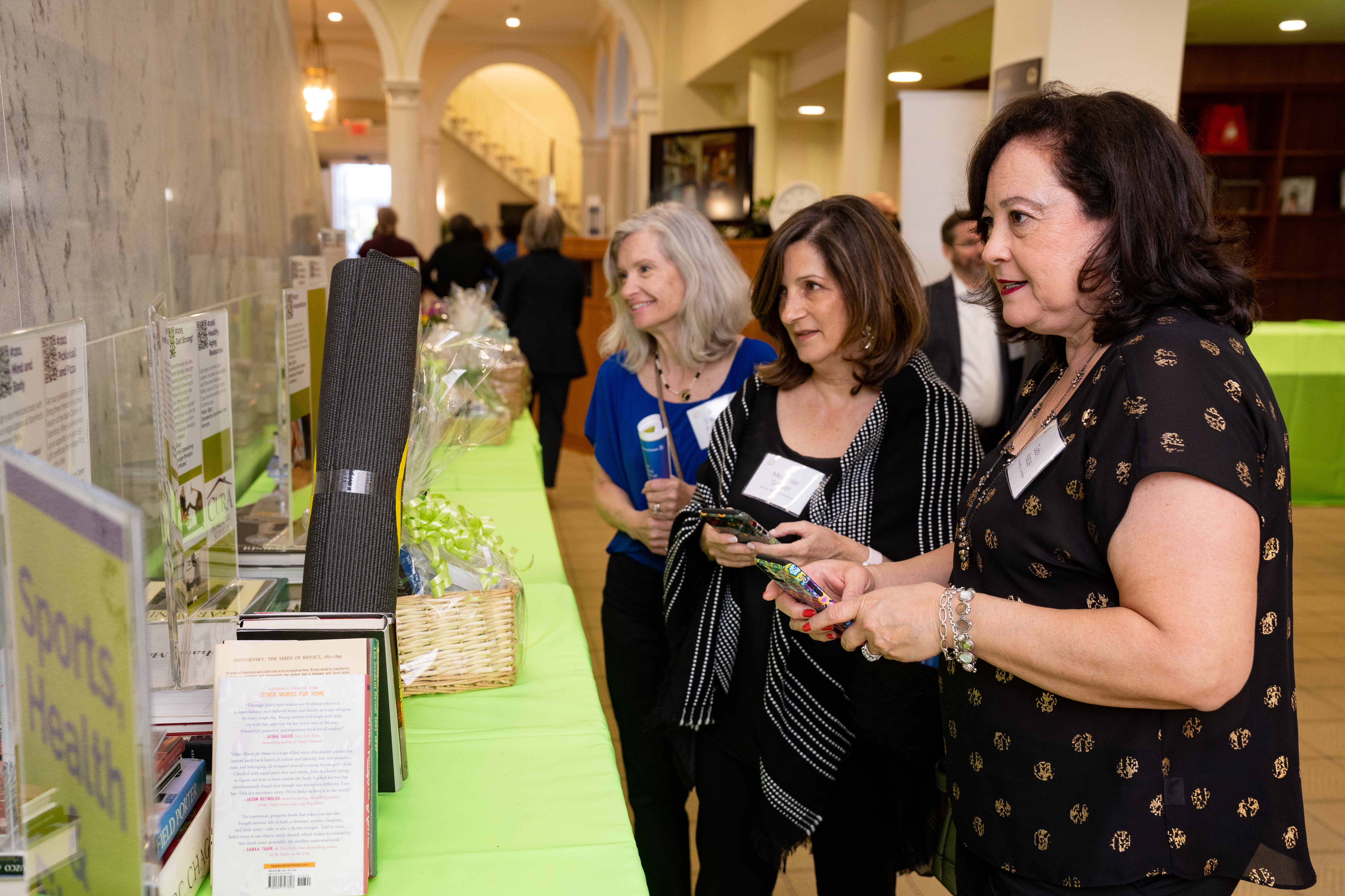 Deborah, Melanie and Gaby looking at auction.jpg 