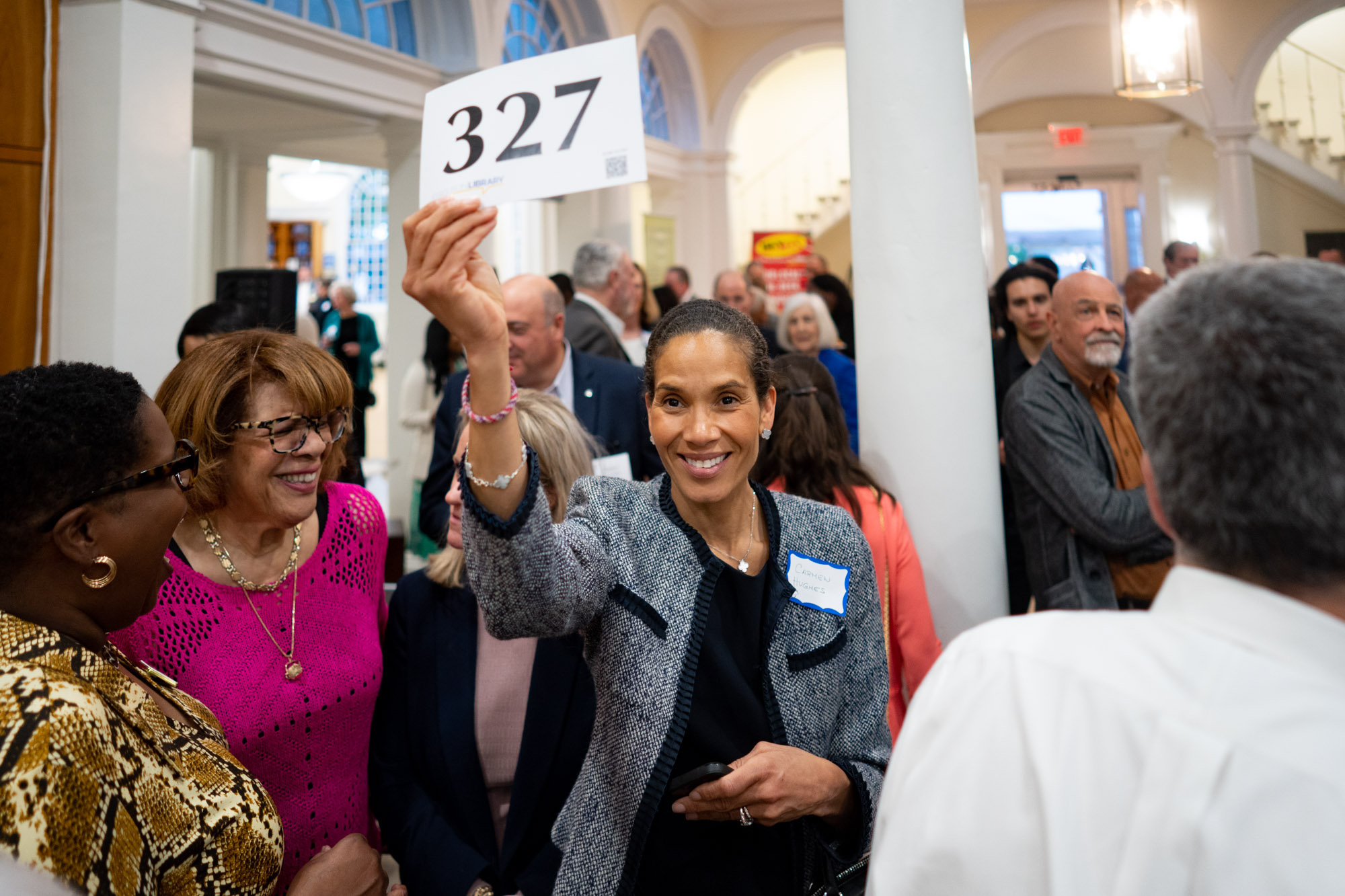 Live auction Carmen Hughes bidding good.jpg